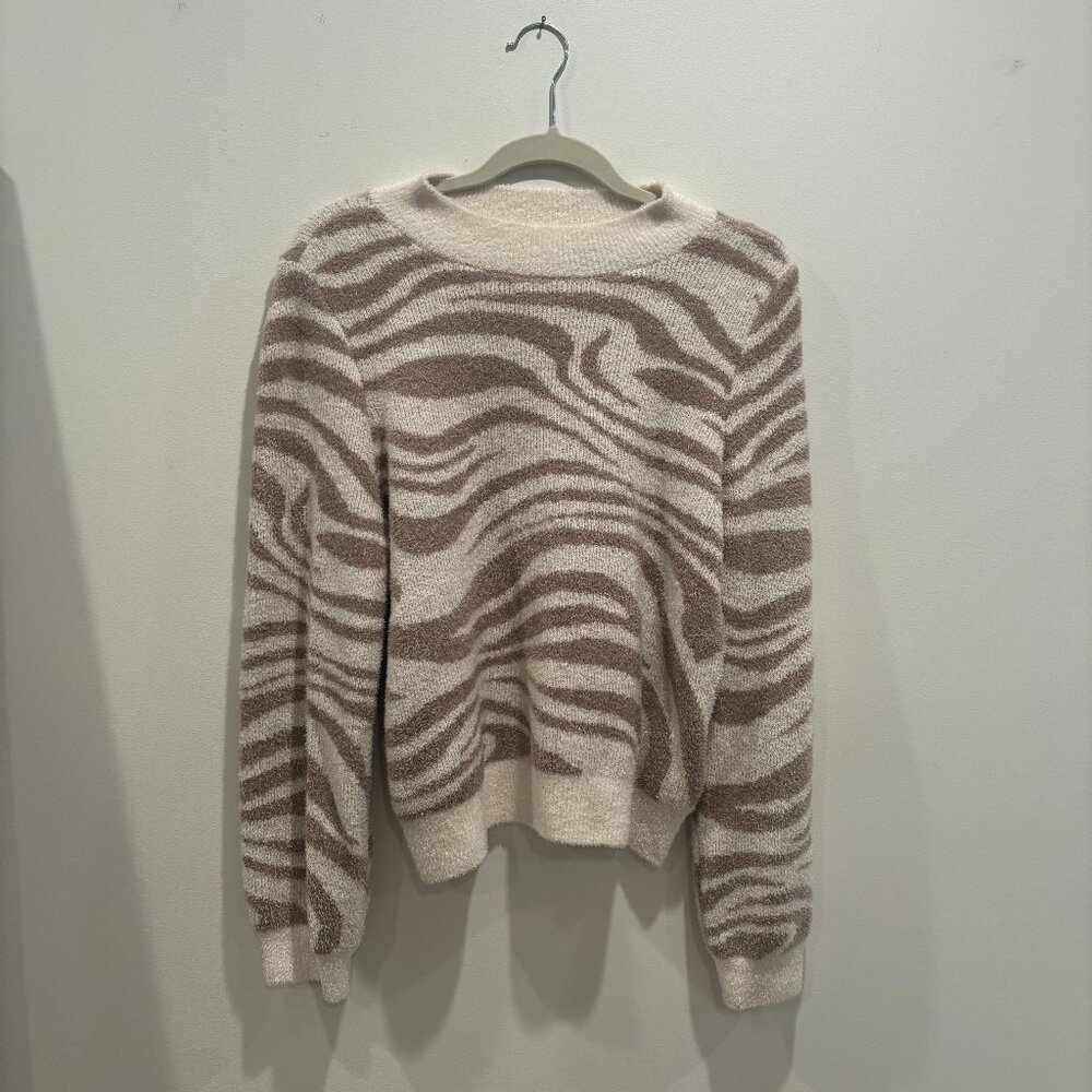 White and brown swirl style sweater